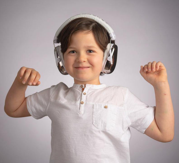 Boy wearing BuddyPhones Guardian earmuffs